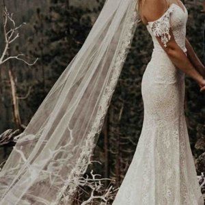 Off-shoulder lace couture wedding dress